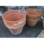 Four large terracotta plant pots - sold with two small pots