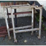 A pair of cast iron industrial table standard ends - sold with a wrought iron tressle/X-frame