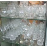 A collection of various cut and moulded glass wines, brandy balloons, tumblers, vases, decanter,