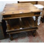 William Sheppee: a pair of iron studded Eastern hardwood square low tables with iron brackets and