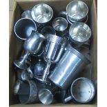 A box containing a quantity of silver plated and pewter goblets and tankards