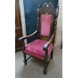 A pair of oak framed throne style carver chairs with carved R.A.O.B. Pinhoe Lodge No.6931 to top