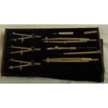 A vintage cased geometry set - one piece missing