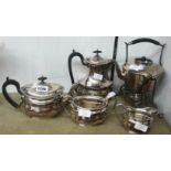 A silver plated four piece tea set of semi fluted design - sold with a spirit kettle on heavy cast
