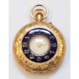 An 18ct. gold lady's fob watch with decorative engraving and blue enamelled chapter ring