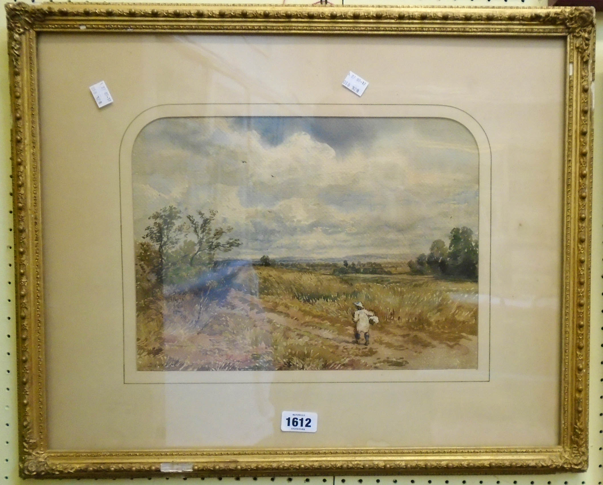 David Cox Jnr.: a gilt framed watercolour depicting a figure on a country track in an extensive