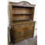 A 3' 7 1/2" Edwardian polished oak two part dresser with reduced two shelf plate rack over a base