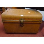 A 23 1/2" late Victorian wood grained tin dome top travelling trunk with brass latch marked for E.