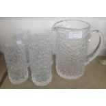 A Whitefriars glacier range clear bark glass pitcher jug and four tall glasses - Geoffrey Baxter -