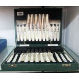 A cased set of twelve each silver plated fruit knives and forks with mother-of-pearl handles