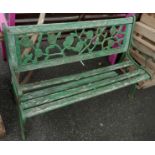 A cast iron garden bench with wooden slatted seats