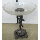 A 9" silver plated tazza with decorative scalloped and cut glass top, supported by a cherub on a