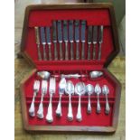 A walnut canteen containing a six place setting of silver plated Kings pattern cutlery by Smith