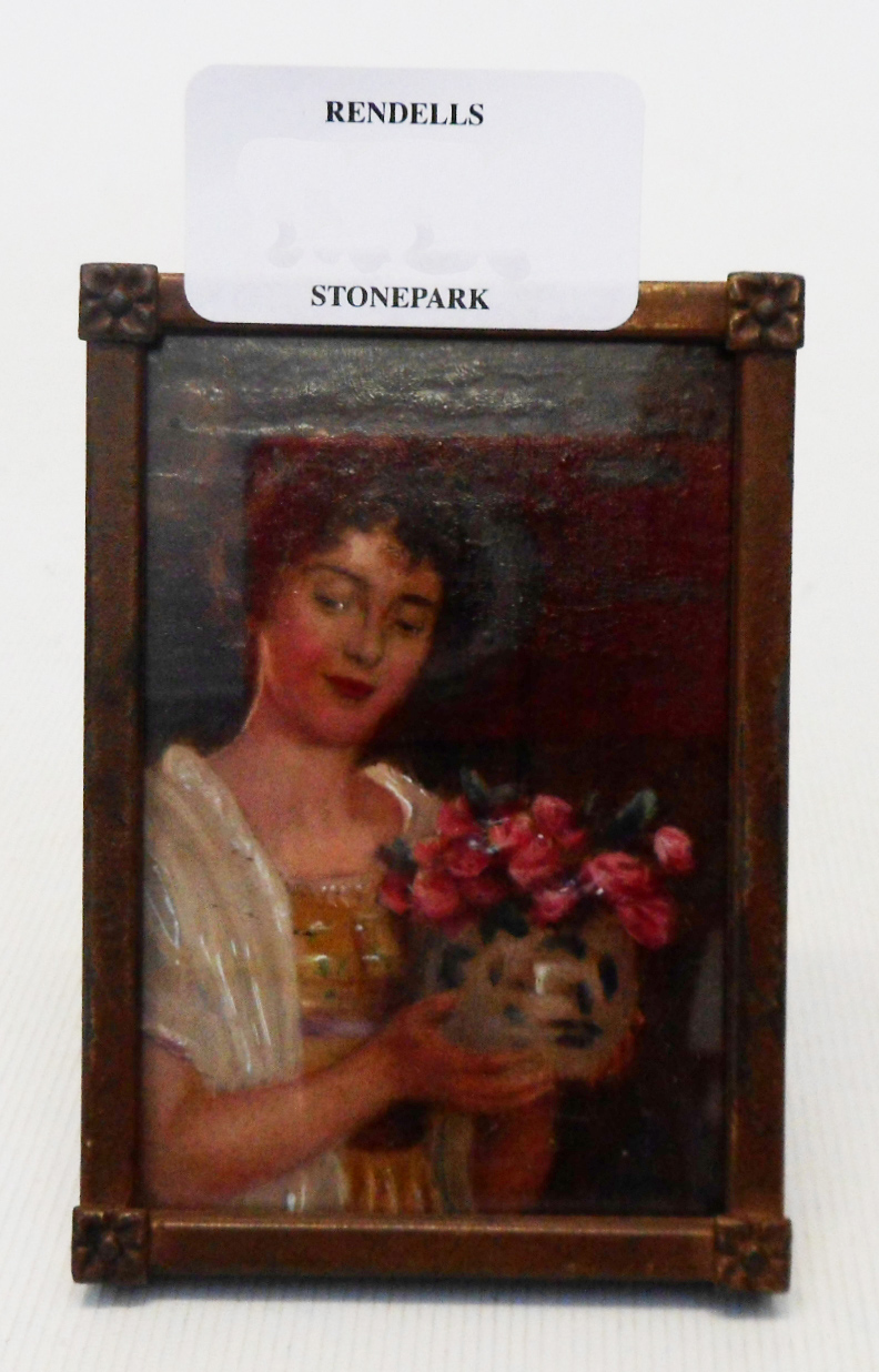 An early 20th Century oil portrait miniature, depicting a lady holding a bunch of flowers - in an