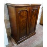 A 29 1/2" Victorian mahogany cabinet by George Davis of Plymouth, with moulded top and slide