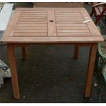 A slatted teak garden table - 35" X 36"