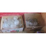 Two boxes containing a quantity of cut and moulded glassware including bowls, vases, candlesticks,