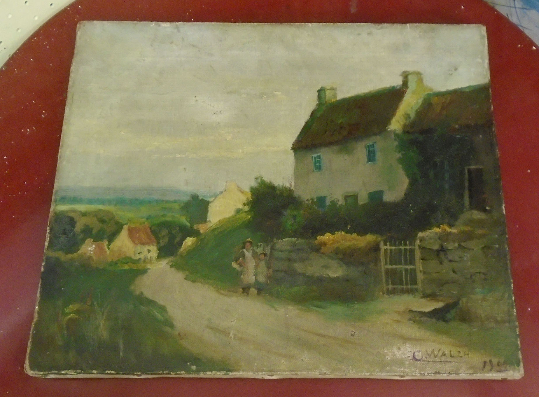 An unframed oil on canvas depicting a Cornish view of figures on a path and