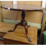 A 26 3/4" diameter mahogany tilt-top table, set on turned pillar (reduced) and tripod base with