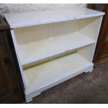 A 3' 6" antique later painted two shelf open bookcase, set on bracket feet - adapted