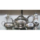 A James Dixon & Son three piece silver plated tea set with engraved decoration, associated tongs and