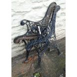 A pair of pierced cast iron bench ends