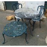 A cast aluminium table and pair of chairs to match - sold with a similar coffee table