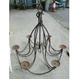 A Gothic style wrought iron six branch chandelier with hanging hook