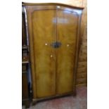 A 33" 20th Century gentleman's walnut veneered wardrobe with hanging space, glazed front