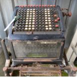 An early 20th Century Burroughs Ltd. portable Adding Machine on fitted stand - a/f