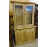 A 3' 5" Victorian waxed pine dresser with glazed top section over a base with single long drawer and