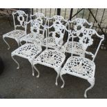 Seven matching cast metal framed garden chairs with scroll and grapevine decoration