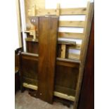 A 4' 19th Century French oak bedstead with later pine slatted base