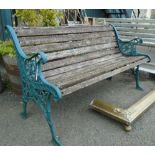 A 4' 2" reproduction bench with pierced cast iron ends and wooden slats