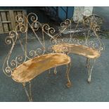 A pair of ornate wire work garden seats with kidney shaped seats and cabriole scroll front legs