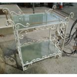 A painted iron framed two tier conservatory table with frosted glass tops