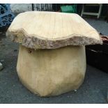 A 24" high chainsaw cut wooden mushroom garden seat/ornament of rustic design