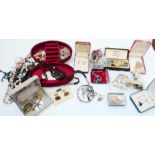 A Constellation vanity case containing a quantity of costume jewellery, a Mondaine wristwatch and