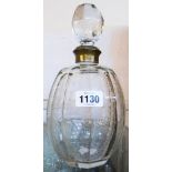 A faceted glass decanter with etched grapevine and C-scroll decoration and worn silver plated