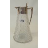 A cut glass claret jug of semi hobnail design with presentation inscription to silver hinged lid -