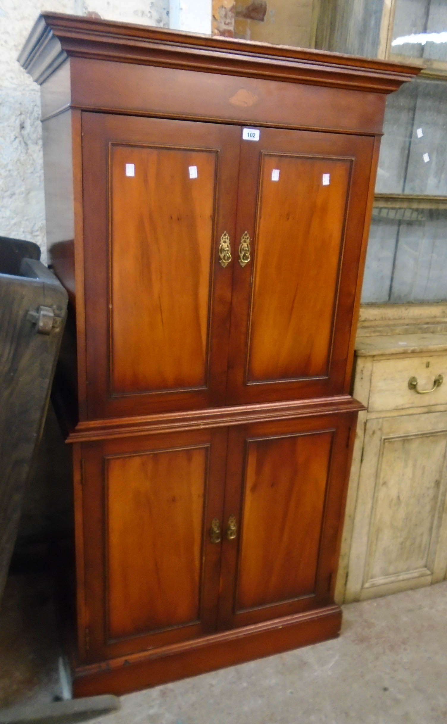 A 34" reproduction inlaid yew wood drinks cabinet with moulded cornice and two pairs of panelled