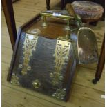 A Victorian brass bound stained oak slope fronted coal box with associated shovel