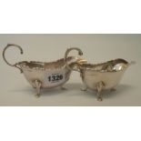 A pair of 6" silver sauce boats with cast rims, set on pad feet - Birmingham 1909