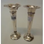 Two silver trumpet vases, one with old repair to stem, both with loaded bases