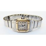 A steel and gold cased Cartier Santos wristwatch with moonphase dial on original bracelet - no