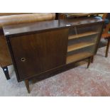 A 3' 6" 1960's stained mixed wood retro book cabinet with adjustable shelves enclosed by glass and