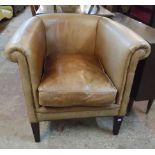 A Laura Ashley studded leather upholstered tub chair, set on square tapered front legs - faded to