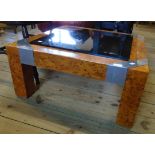 A 29¼" retro burr wood veneered, aluminium corner bound and smoked glass top coffee table, set on