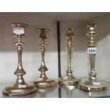 Two pairs of silver plated candlesticks