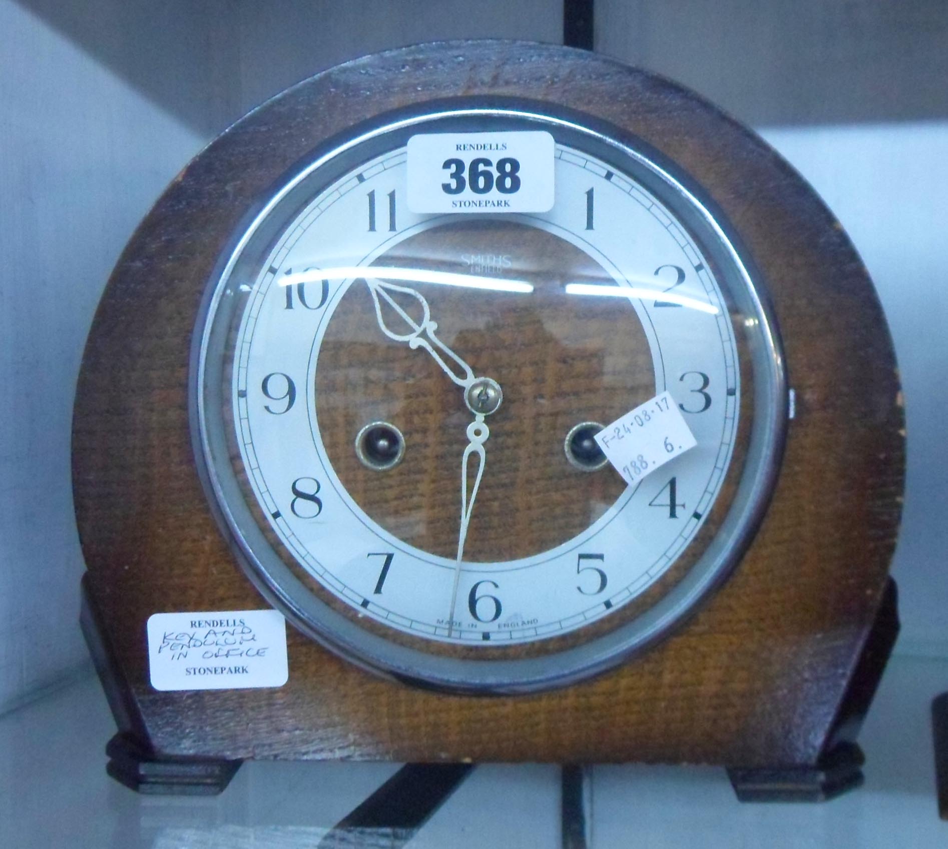 A mid 20th Century polished oak cased Smiths Enfield mantel clock with eight day gong striking